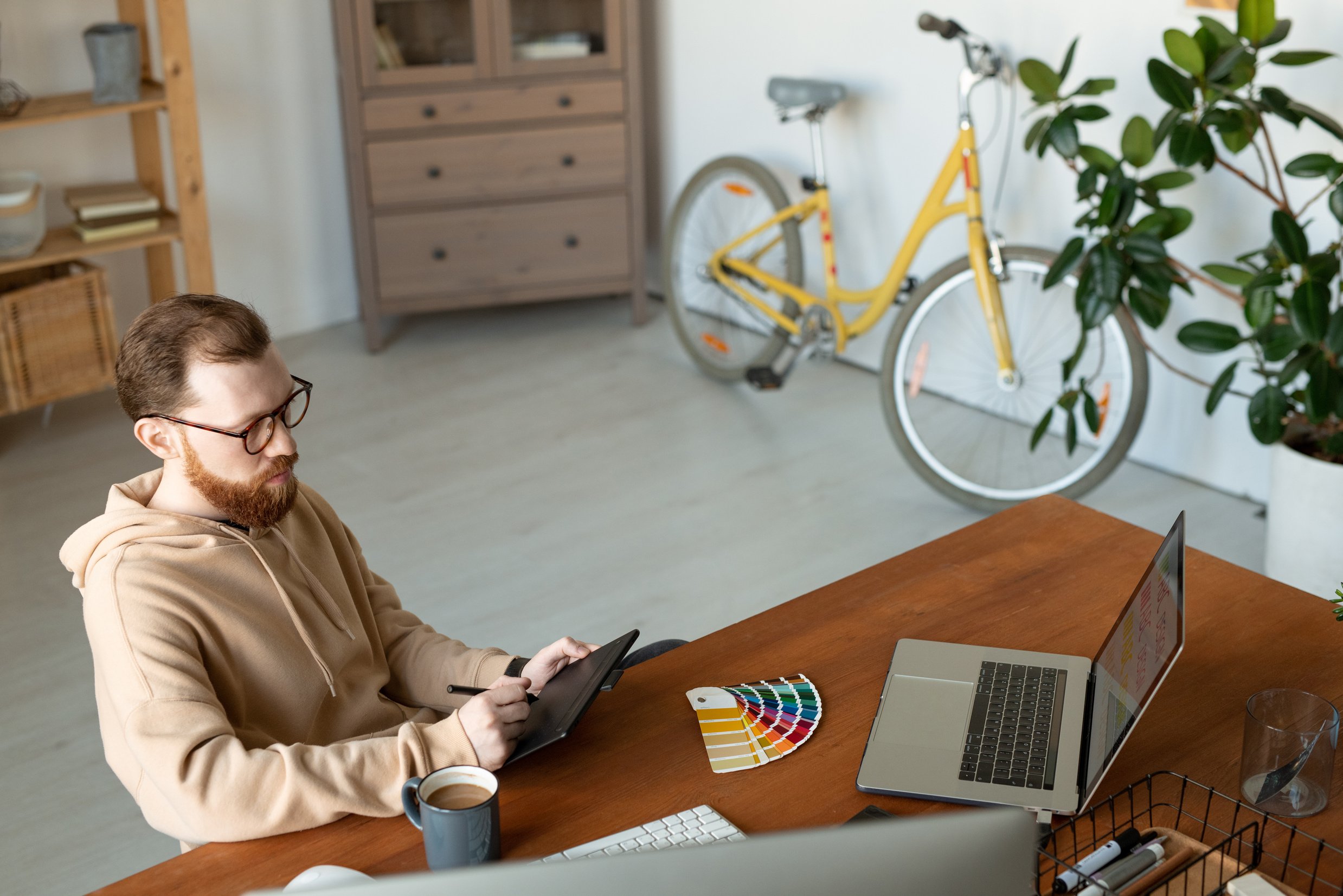 Hipster graphic designer working from home